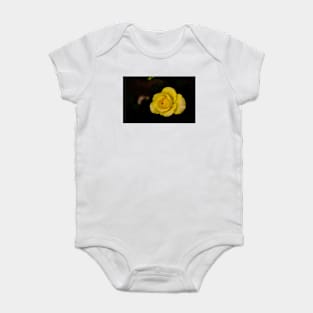 single yellow rose blossom on black background Baby Bodysuit